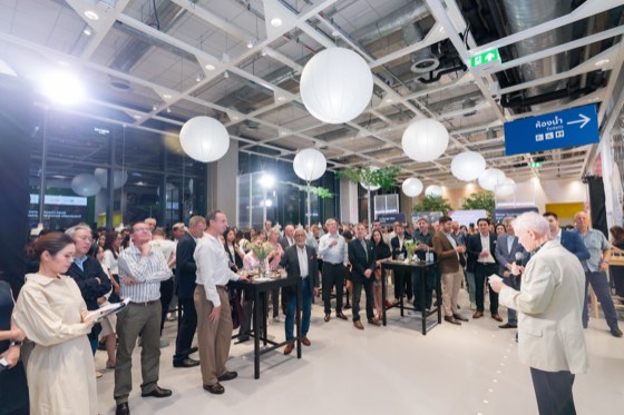 A crowded reception under paper lanterns