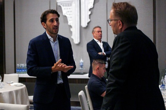 Two guests talking at a breakfast event
